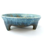 Ruskin Pottery bowl, turquoise and sepia speckled glazed and raised on three lug feet,