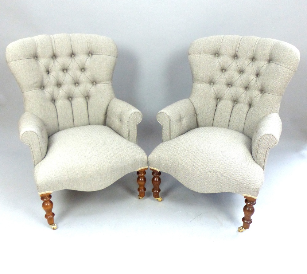 Pair of Herringbone upholstered study chairs, buttonback, turned legs and brass casters.