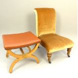 Victorian nursing chair, walnut turned feet, ceramic castors, later caramel upholstery,