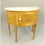 Early 20th C continental wash cupboard, demi-lune shape, variegated marble top, single panel door,