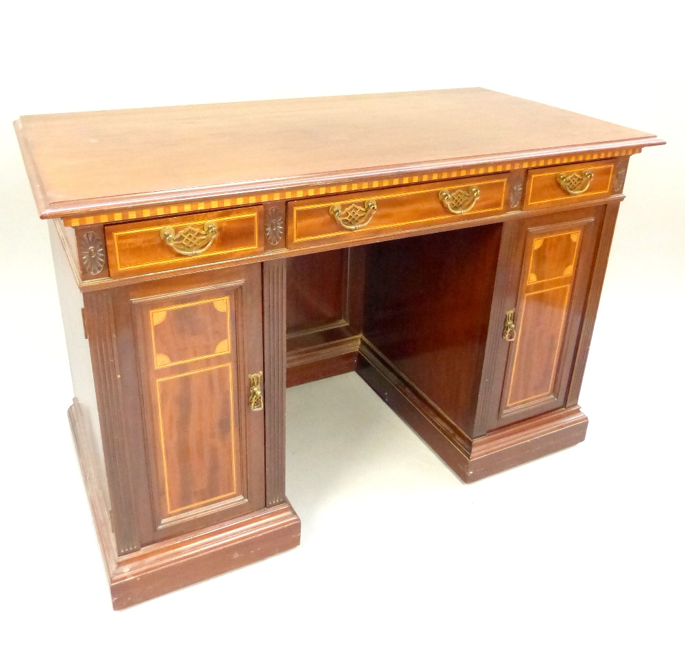 Edwardian mahogany and satinwood inlaid pedestal desk,