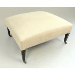 Large upholstered stool, the rectangular seat covered in an oatmeal fabric,