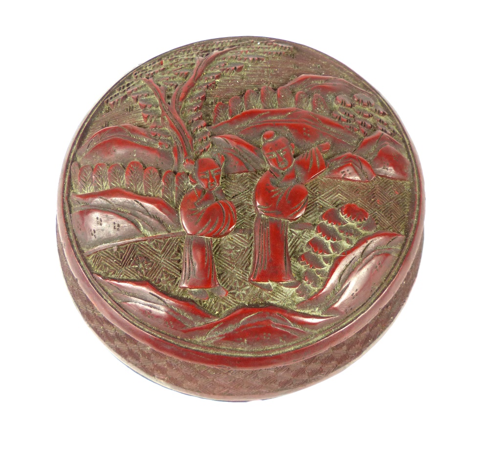 A Chinese antique carved cinnabar lacquered circular box and cover, 7.