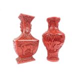 Two red cinnabar lacquer vases decorated with figures, scrolling flowers and trees,