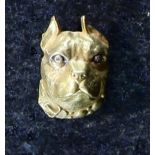 An unusual jewelled dog brooch in 18ct yellow gold, the textured, moulded,