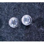 A pair of antique diamond stud dress earrings in 18ct gold, each central round cut diamond,