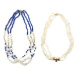 Two pearl necklaces one comprising three strands of pearls with an 18ct yellow gold bow with