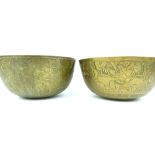 Pair of heavy Chinese brass bowls decorated with warriors, character marks to underside,