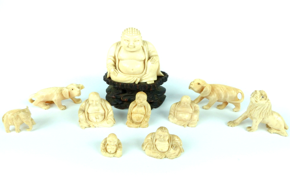19th C carved ivory Buddha seated on hardwood stand together with five smaller Buddhas,