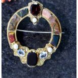 An Antique Scottish jewelled hardstone brooch in yellow gold,