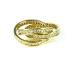 CARTIER A vintage three band eternity interlocking diamond ring in 18ct yellow gold. The three bands