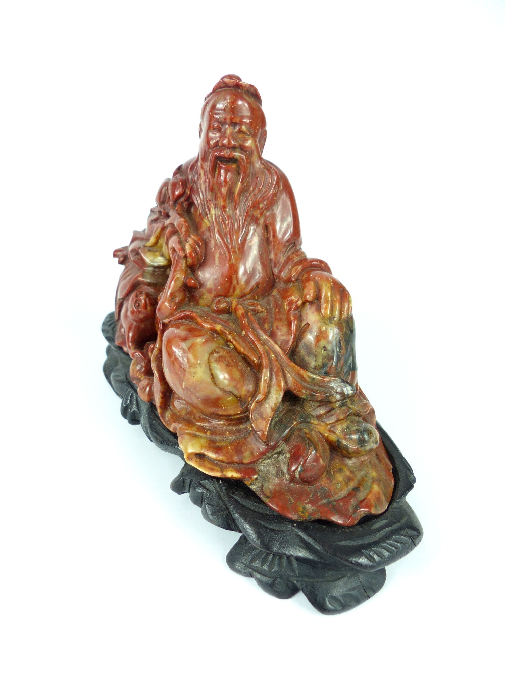 Two Chinese antique carved soapstone figures of bearded immortals, each signed on their bases, - Image 4 of 4