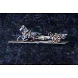 A jewelled horse and chariot bar brooch in 15ct yellow gold, the horse set with round cut diamonds,