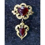 An antique Victorian garnet brooch in yellow gold,