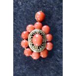 An Antique 19th Century Coral Pendant in high carat yellow gold,