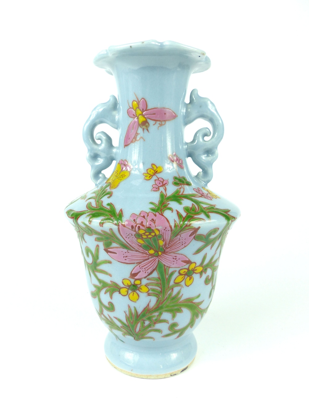 A Chinese blue monoglazed twin handled porcelain vase of shouldered ovoid form,