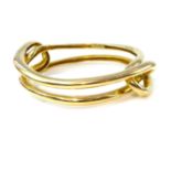 CARTIER a vintage ladies bangle in 18ct yellow gold,