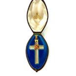 An antique rock crystal and coral cross pendant with high carat yellow gold loop the cross with a