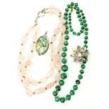 Two hardstone necklaces one in malachite and one in rose quarts,