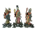 Three Chinese antique carved wood and polychromed lacquered figures of immortals,
