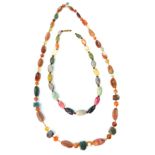 Two hardstone necklaces with mixed oval, square and round cut beads. Lengths 48cm / 19”, 80cm / 31.