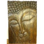 Large carved panel, a study of the head of wooden Buddha.