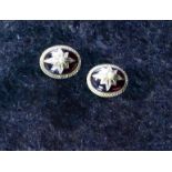 A pair of antique garnet and seed pearl stud earrings in 9ct yellow gold,