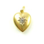 An antique Edwardian diamond heart pendant in 15ct yellow gold, marked 1903,