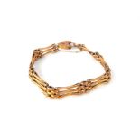 9ct gold padlock and bar chain bracelet, 10.