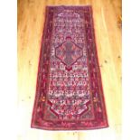 Senneh rug, overall with geometric design and central medallion over ivory ground within red border,