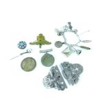 Charm bracelet with assorted silver charms including envelope, bell and padlock, a white metal nurse