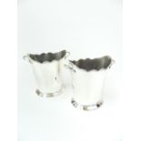 Pair of silver plated oval wine coolers, with a shaped ball moulded rim and twin handles, raised