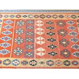 Kazak kilim carpet, geometric design over pink and yellow ground, 263x163cm