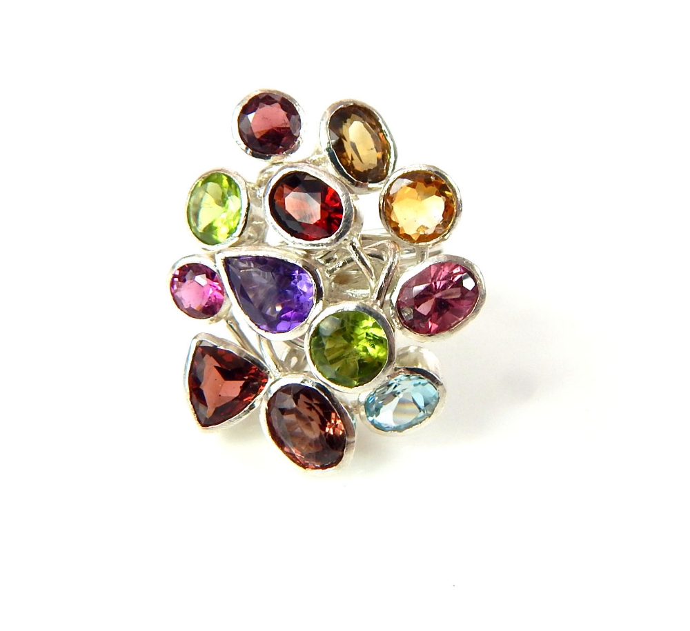 Multi colour gem set ring, on a ribbed band white metal band, 14g