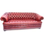 Red leather Chesterfield sofa, buttonback seat + apron, triple seat, 210 cm w