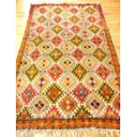 Moroccan tribal rug, polychrome decorated with geometric design over cream ground,