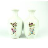 Pair of Chinese bottle vases decorated with children carrying vases and flowers, blue four character