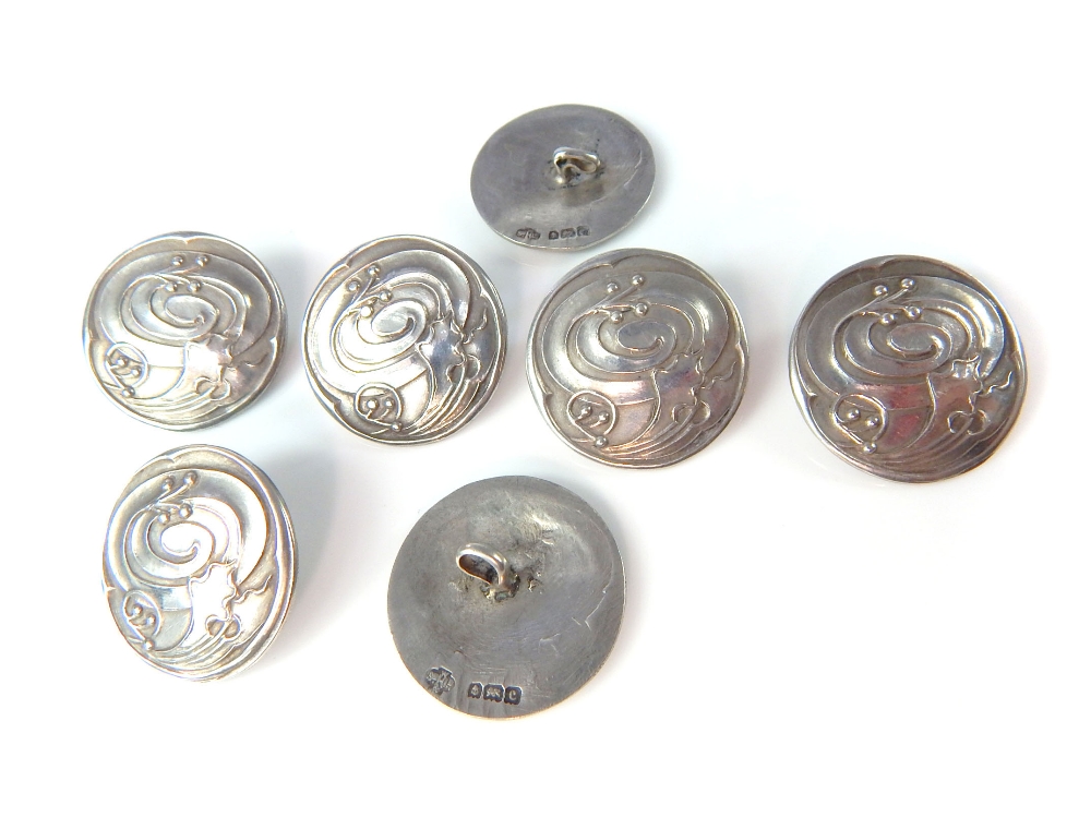 Seven Sterling silver Art Nouveau buttons, marked Hutton & Sons Birmingham 1902