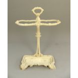 Early 20th C cast iron stick stand of Art Nouveau form, leaf and scroll decoration, drip pan
