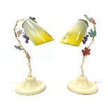 Pair of Continental cream painted metal table lamps, foliate and grape decorated,