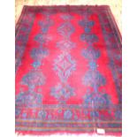 Large Oushak red ground carpet, geometric spandrels, fringed, 397x305cm