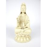 Blanc de Chine figure Guanyin holding a lotus flower + vase, sealed on a lily pad, impress to