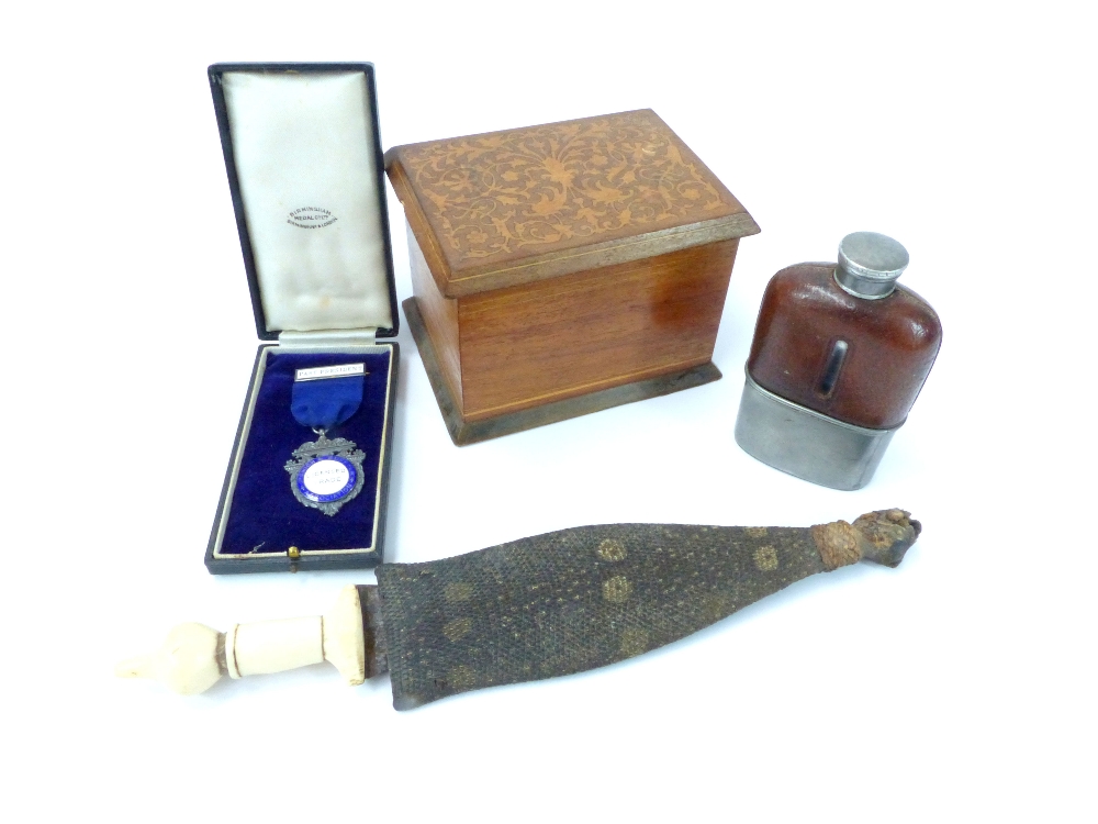 Wooden cigarette dispenser with rising mechanism, inlaid hinged lid, a leather clad hip flask and