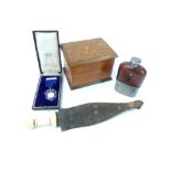 Wooden cigarette dispenser with rising mechanism, inlaid hinged lid, a leather clad hip flask and