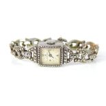 BUCHERER An antique Art Deco cocktail watch in silver and marcasite, the square face and wind up