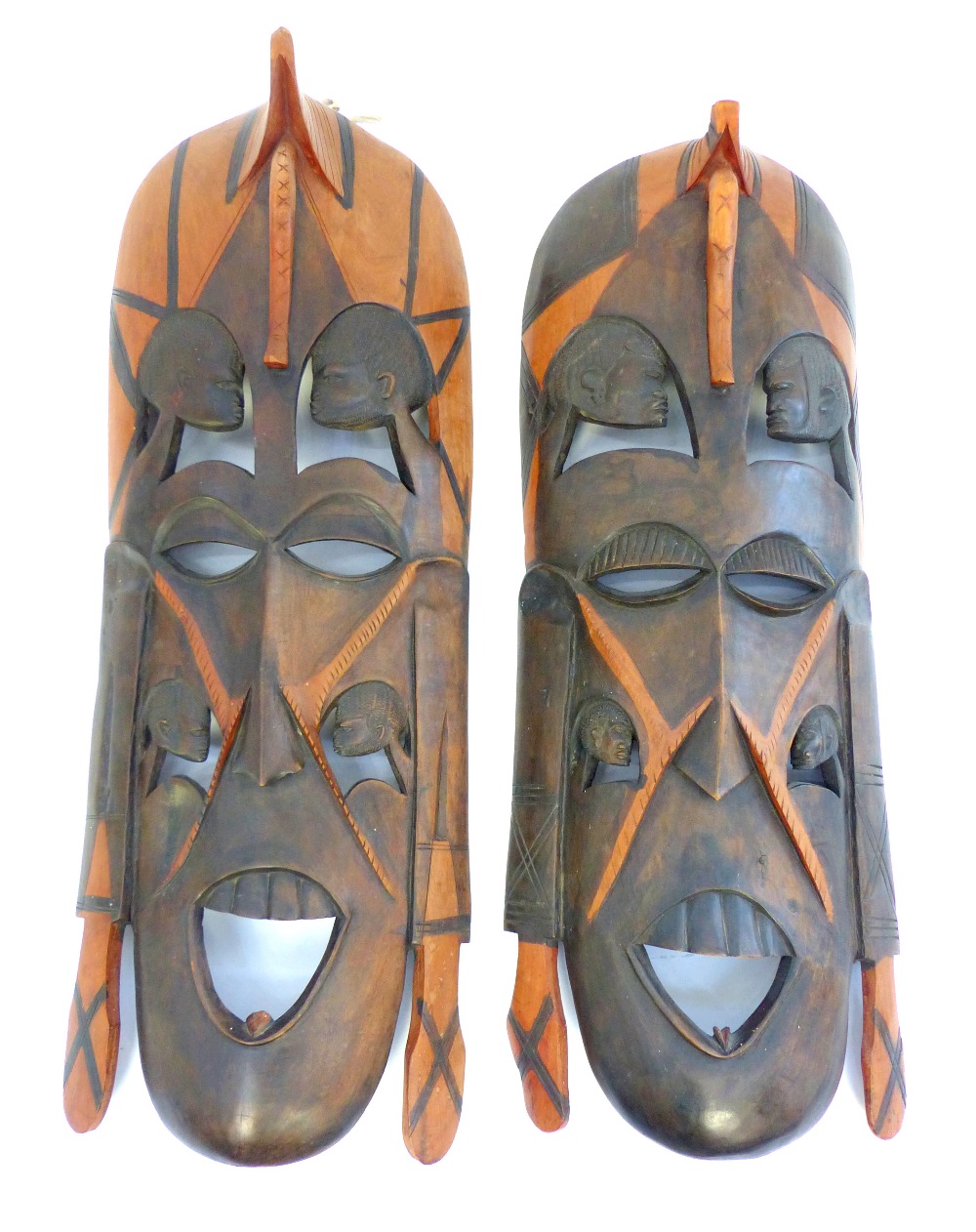 Pair of large African figural carved hardwood tribal wall masks, 90cm high (2)