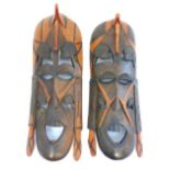 Pair of large African figural carved hardwood tribal wall masks, 90cm high (2)