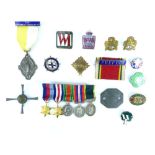 Row of miniature WWII military Medals and ribbons including Territorial, a dog tag, Catholic