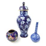 19th century chinoiserie porcelain vase and cover, floral and gilt design over indigo ground, 29cm