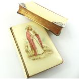 Two prayer books; circa 1900, ivorine with silver corners and another with Jesus the shepherd. (2)